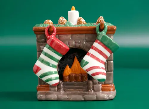Salt and Pepper Shakes in the Shape of Stockings on a Fireplace