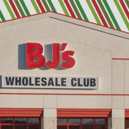 BJ's Wholesale Club store with a striped Christmas background