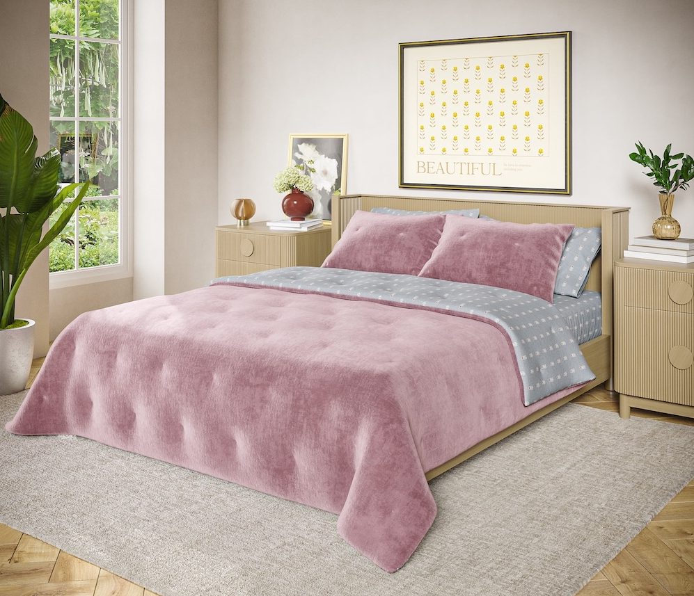 Drew Barrymore Beautiful Signature Floral Woodrose Velvet Reversible Quilt in a bedroom