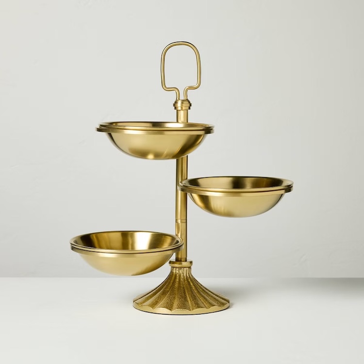 A brass tiered snack serving stand