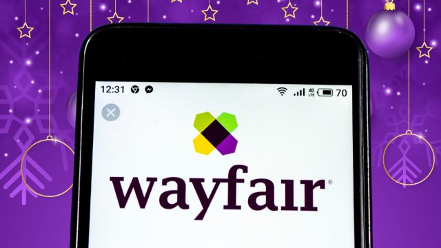 wayfair logo on phone with a purple festive background