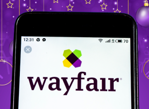 wayfair logo on phone with a purple festive background