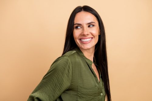 portrait of a woman wearing an olive green blouse