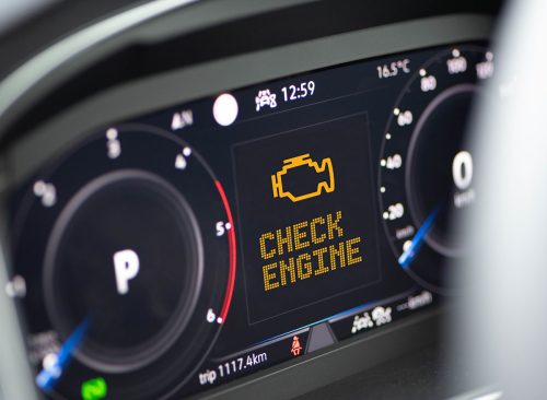 Interior of a modern car and a Check Engine warning light