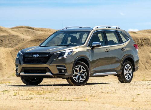 Brno, Czech Republic - June 22, 2024: Green Subaru Forester SUV with all-wheel drive. Off-road car on sand dunes.