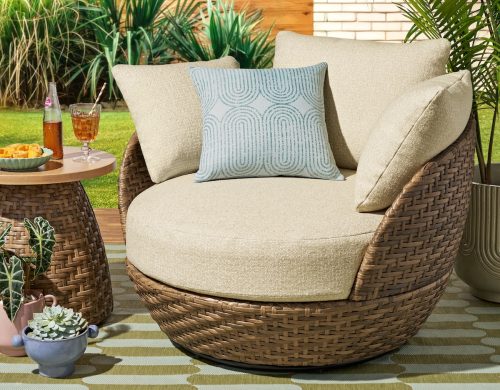 outdoor swivel chair with throw pillow