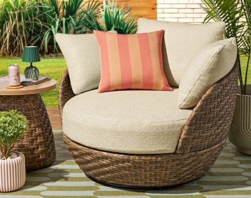 outdoor swivel chair with throw pillow