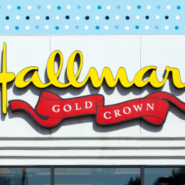 Hallmark Gold Crown store with a blue polka dot background