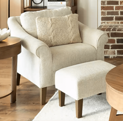 cream-colored arm chair and ottoman