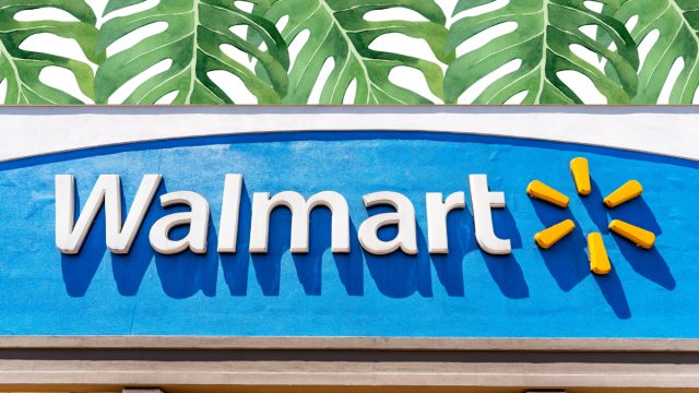 Walmart store sign with a leaf background