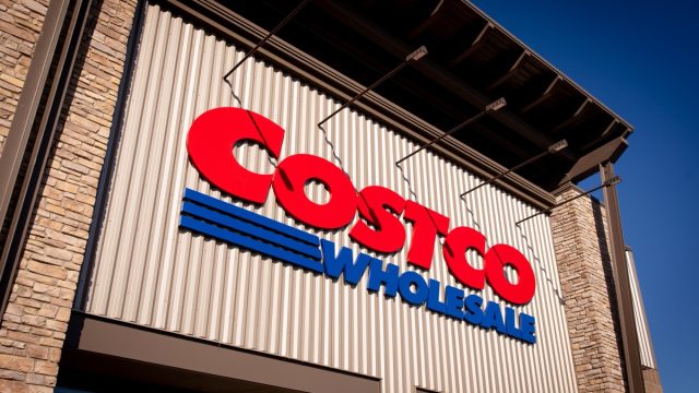 Bend, Oregon US - June 6, 2025: Costco logo sign on one of its stores modern facade. Costco Wholesale exterior trademark logo. Copy space