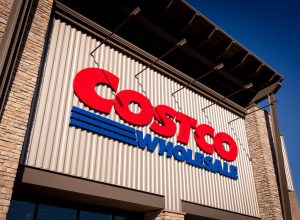 Bend, Oregon US - June 6, 2025: Costco logo sign on one of its stores modern facade. Costco Wholesale exterior trademark logo. Copy space