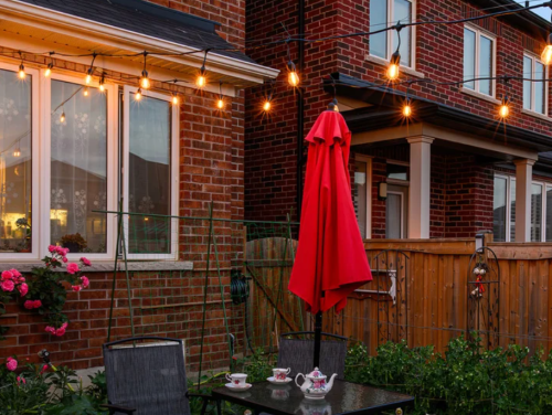outdoor LED string lights hanging in a backyard