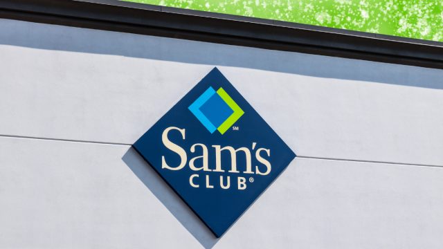 Sam's Club sign on a store with a bright green background