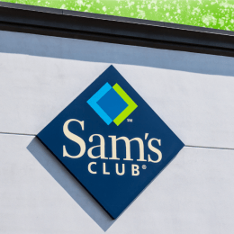 Sam's Club sign on a store with a bright green background