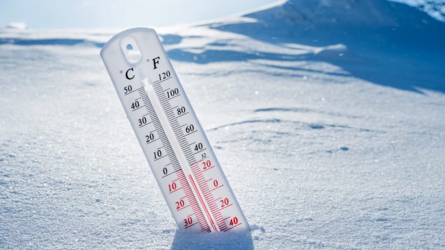 A thermometer stuck in the snow