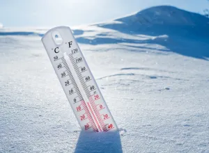 A thermometer stuck in the snow