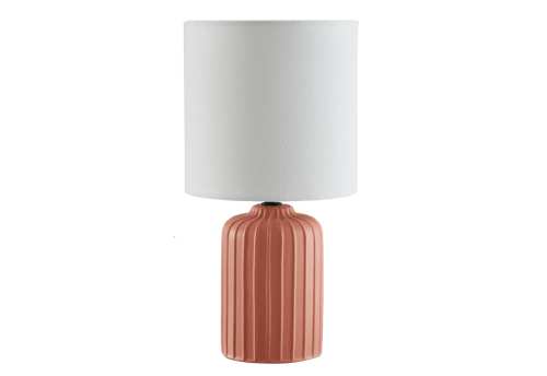 coral colored table lamp with white shade
