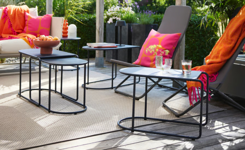 black outdoor nesting tables on a patio