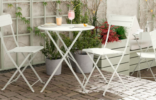 white metal outdoor table and chairs
