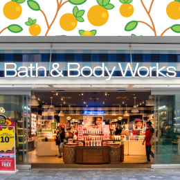 Bath & Body Works storefront with an orange fruit background