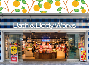 Bath & Body Works storefront with an orange fruit background