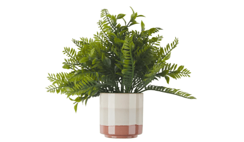 faux plant in a beige ceramic pot