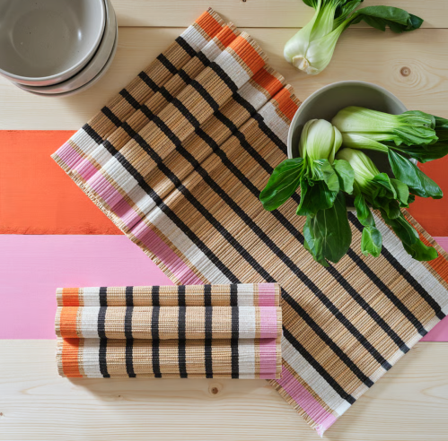 women pink, orange, beige, and black table runn er