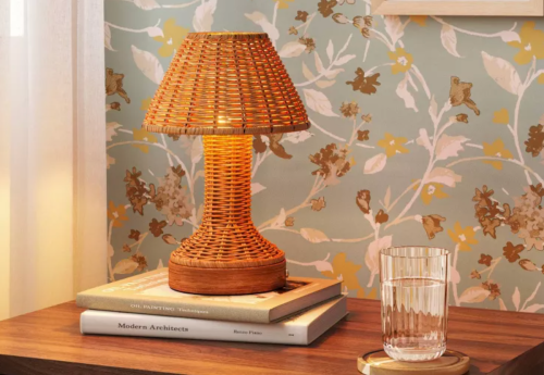 cordless rattan table lamp on a night stand