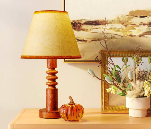 Wood table lamp with a beige shade