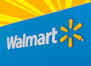 Closeup of a Walmart storefront with a yellow and orange background