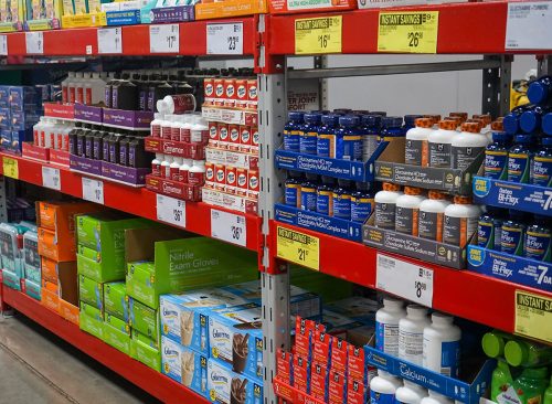 Rows of nutritional supplements on the shelf in the health aisle at a Sam's Club supermarket