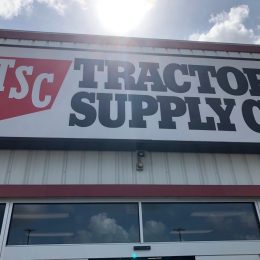 Tomball, TX /USA - May 23rd 2020: outside shot of the tractor supply co from a low angle with the sun above during current coronavirus lockdown.