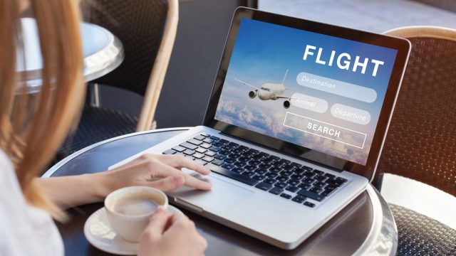 flight search on internet website, travel planning concept, airplane tickets online