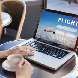 flight search on internet website, travel planning concept, airplane tickets online