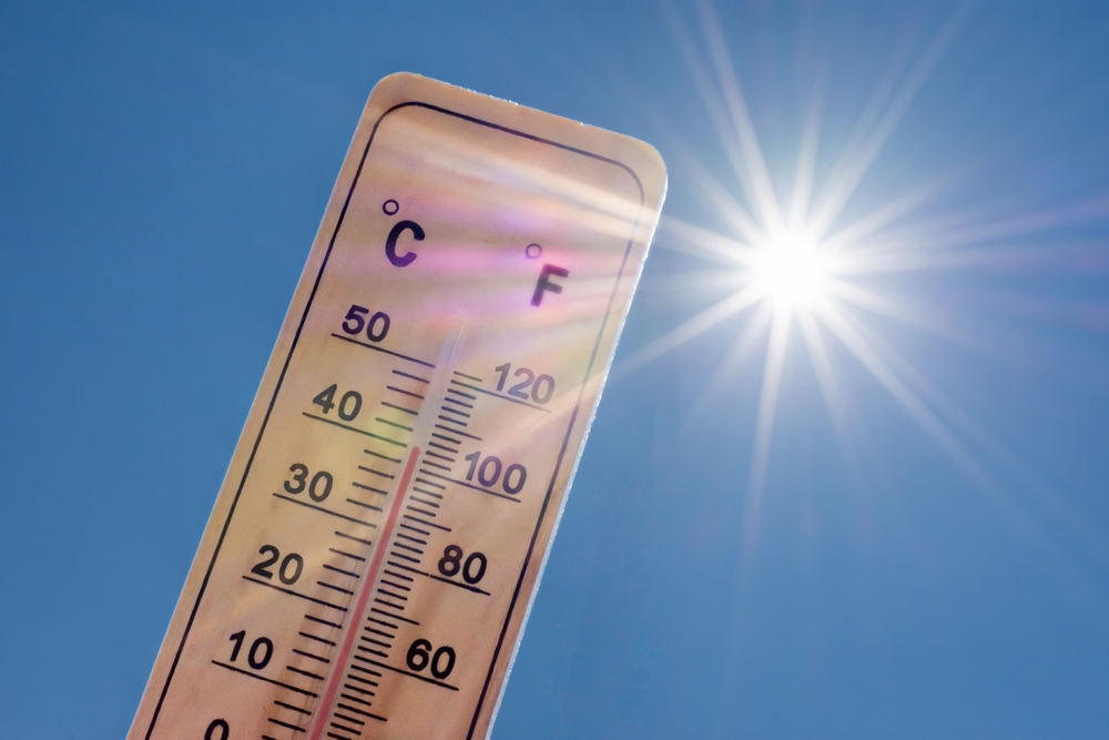 A thermometer displaying high temperatures in the sun