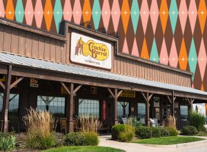 11 Best New Cracker Barrel Vintage and Nostalgic Decor Finds Under $15. Belton, Missouri - August 23, 2025: Sun shines on the front porch of a Cracker Barrel restaurant.