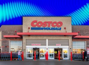 11 Costco Organization Finds a Professional Organizer Would Actually Approve Of. Calgary, Alberta, Canada. Mar 10, 2025. Costco Wholesale entrance with shoppers, carts, and signage. The building features brick and concrete with large glass doors and red accents.