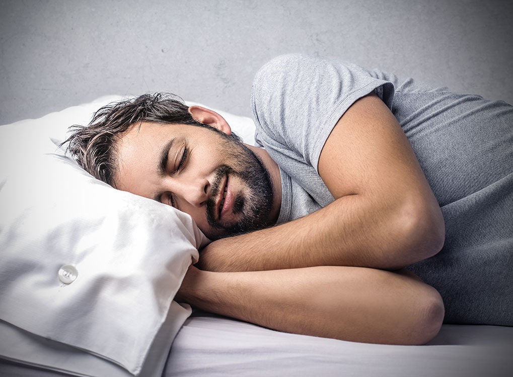 man sleeping on white pillow, weight loss motivation