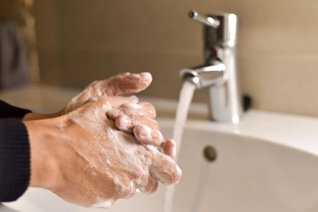 healthy man washing hands