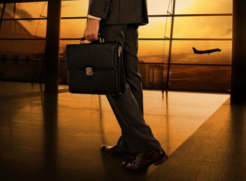 Business traveler with briefcase in airport