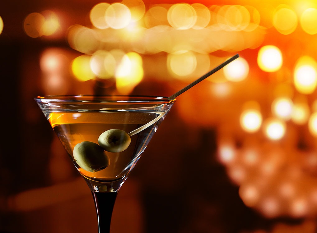 a classic martini in a warmly lit bar