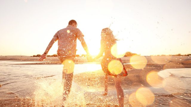 couple on beach happier