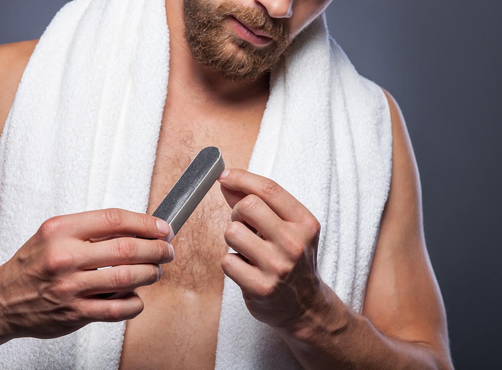 man filing nails old beauty products
