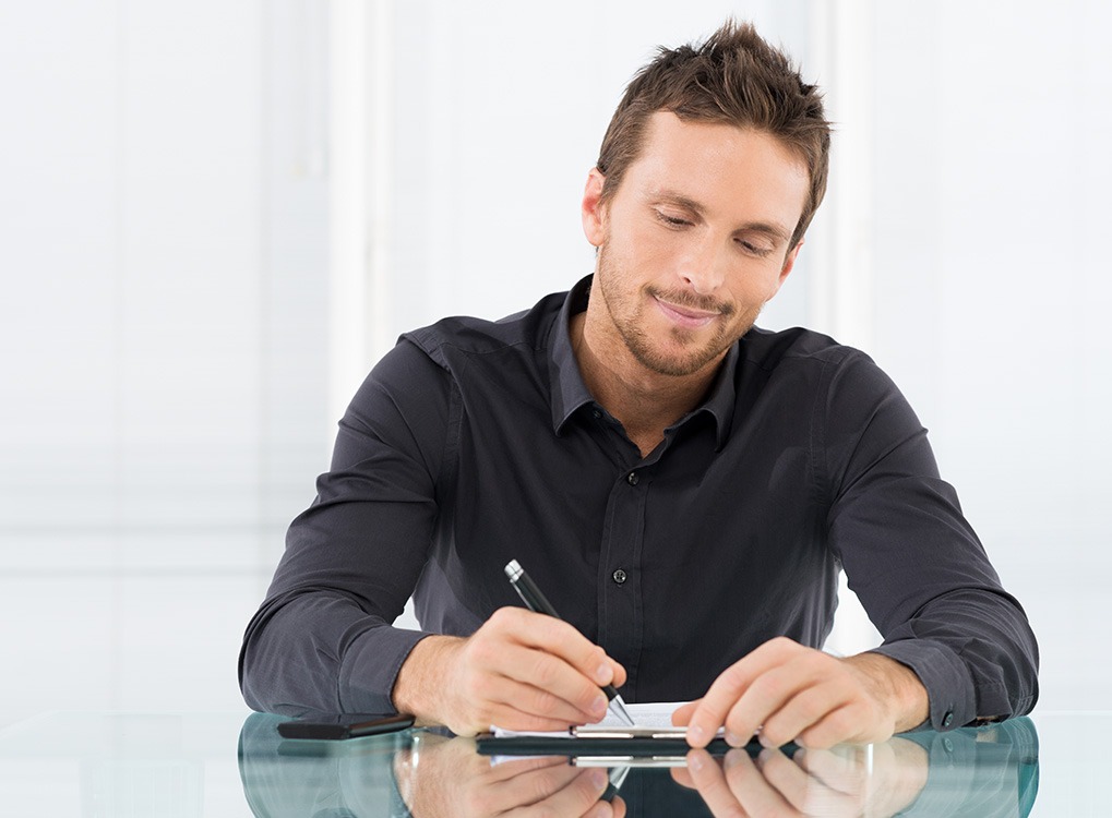 Man writing things down ways to de-stress